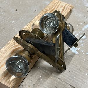 Brass and glass door handles. Hardware works and glass is in great condition.